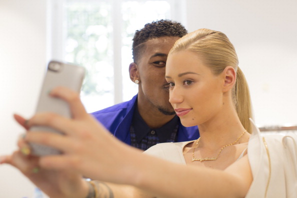 MILAN, ITALY - JUNE 22: Nick Young and Iggy Azalea pose backstage during the Calvin Klein show as part of Milan Fashion Week Menswear Spring/Summer 2015 on June 22, 2014 in Milan, Italy. (Photo by Kevin Tachman/WireImage)